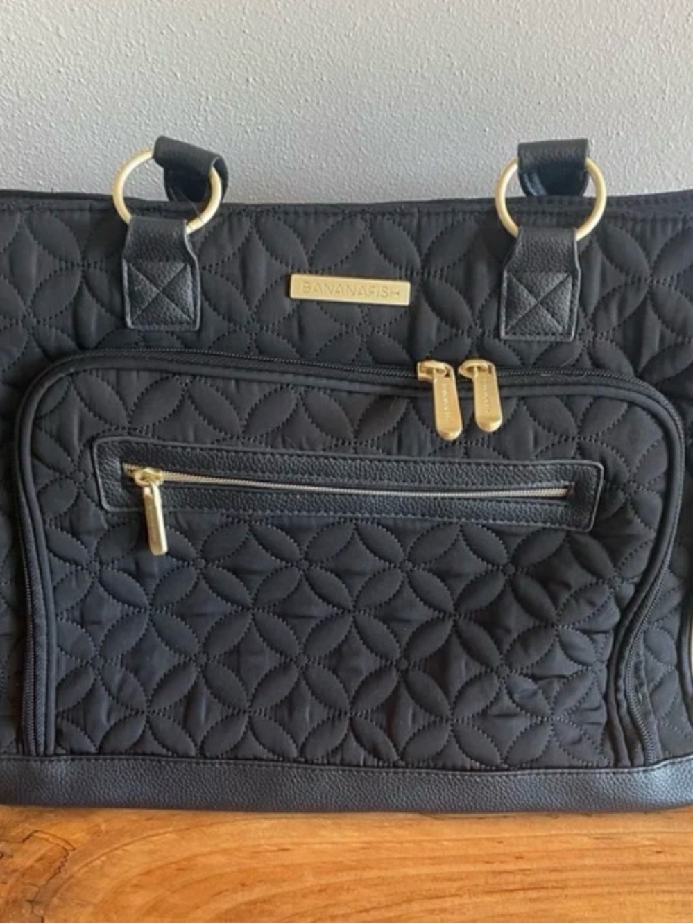 Bananafish Roxanna black quilted tote bag with heavy duty brushed gold hardware.